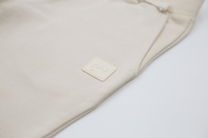 Rib cuff and elastic waistband detail on oat french terry kids sweatpants