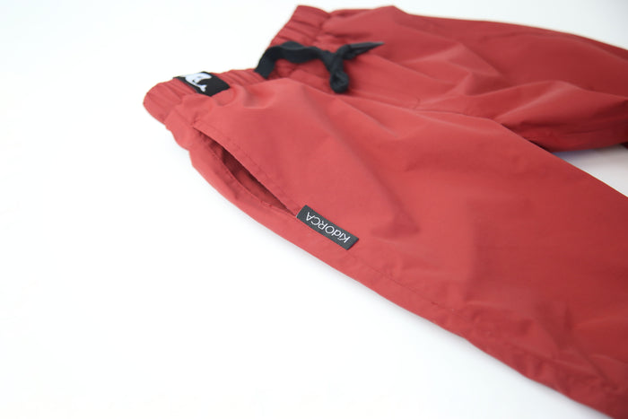 Close-up of waterproof breathable fabric – merlot rain pants
