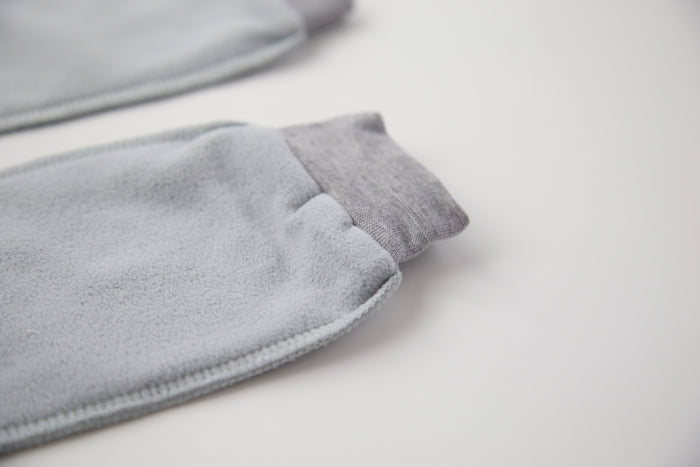 Close-up of grey fleece sock fabric texture – plush and warm