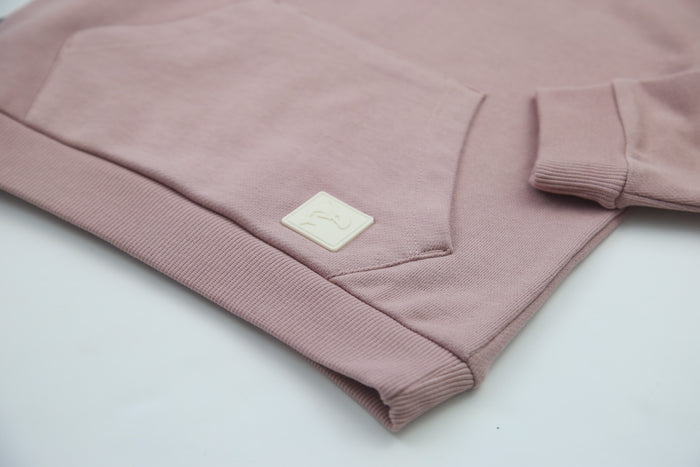 Kangaroo pocket and rib cuff detail on mauve french terry kids hoodie