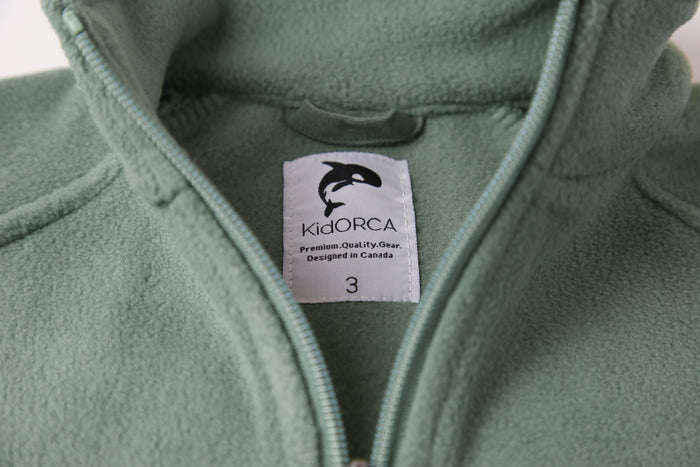Close-up of soft fleece fabric – olive kids jacket
