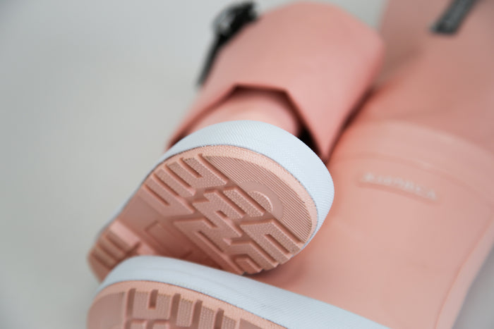 Close-up of rubber material and non-slip sole – coral rain boots waders