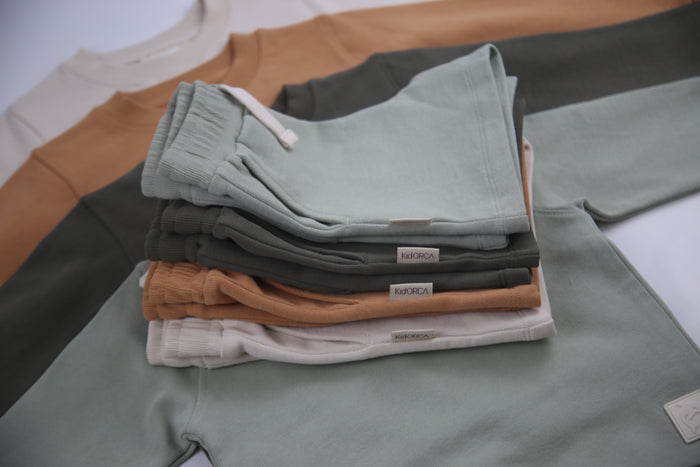 Close-up of french terry fabric and elastic waistband – dusty olive kids shorts