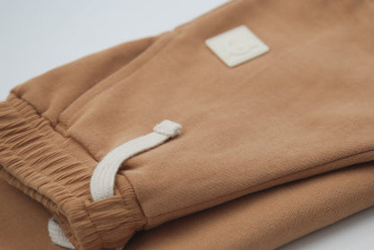 Close-up of organic french terry fabric texture – sandstone kids shorts