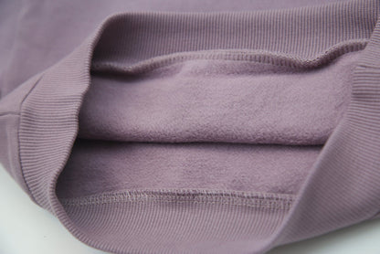 Close-up of brushed terry fabric and tapered fit – wheat kids sweatpants