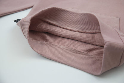 Close-up of organic french terry fabric texture – mauve kids sweatpants