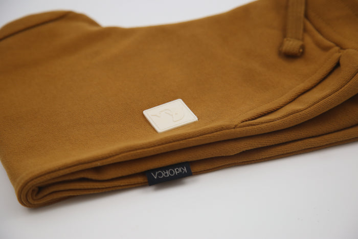 Rib cuff and side pocket detail on ginger french terry kids sweatpants