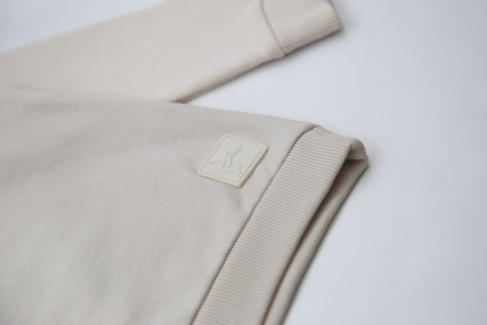 Rib cuff and hem detail on oat french terry kids sweatshirt