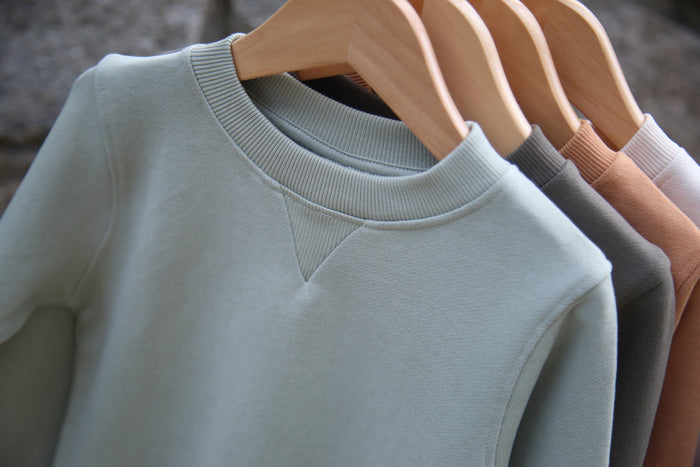 Close-up of french terry fabric texture and crewneck – sage kids sweatshirt