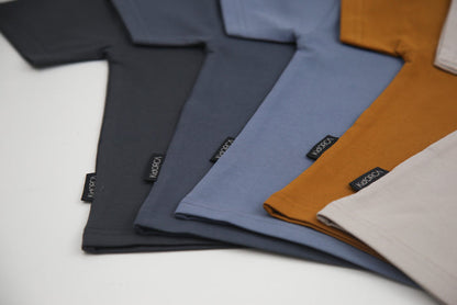 Seam and hem detail on dove grey kids tee