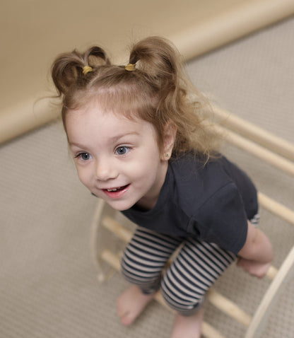 Kid playing in lava organic cotton tee by KidORCA