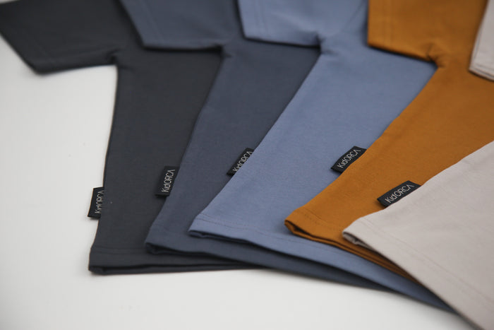 Close-up of organic cotton fabric on lava kids tee