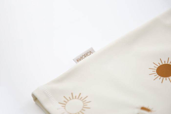 Close‑up of stretchy quick‑dry fabric – Sun Rays Shell baby jumpsuit