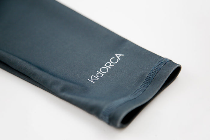 Close-up of YKK zipper and quick-dry recycled nylon fabric – Fjord rashguard