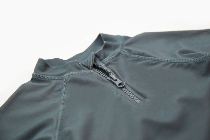 Close-up of YKK zipper and quick-dry recycled nylon fabric – Fjord rashguard