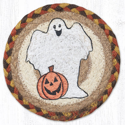 A round, hand stenciled trivet with a ghost design and a jack-o-lantern. The trivet has a braided border in orange, brown and yellow colors.