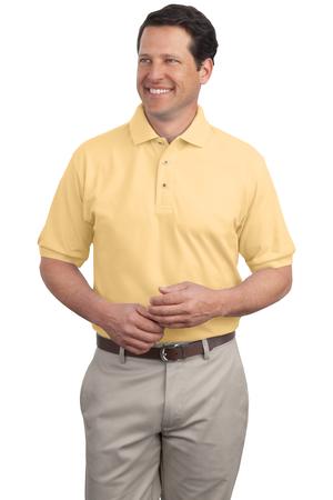 Male model in Port Authority Silk Touch Polo in banana yellow, featuring short sleeves, silky soft texture, and a classic three-button placket.
