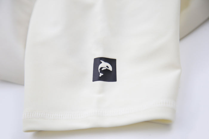 Close-up of UPF 50+ quick-dry recycled polyester – palm tree rashguard