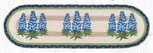 Bluebonnet design stair tread or small table runner with blue, green and tan colors.