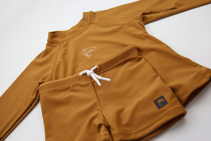 Close-up of quick-dry recycled polyester fabric – ginger boardie shorts