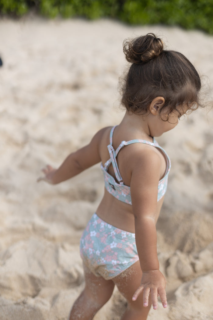 Girl wearing Evangelina sage swim bottom – side view