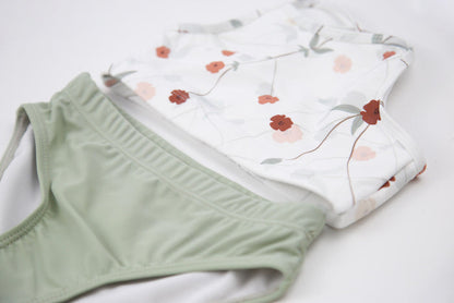 Elastic waistband detail on sage green swim bottom