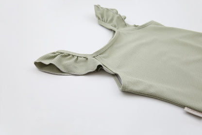 Close-up of waffle weave textured quick-dry fabric – sage swimsuit